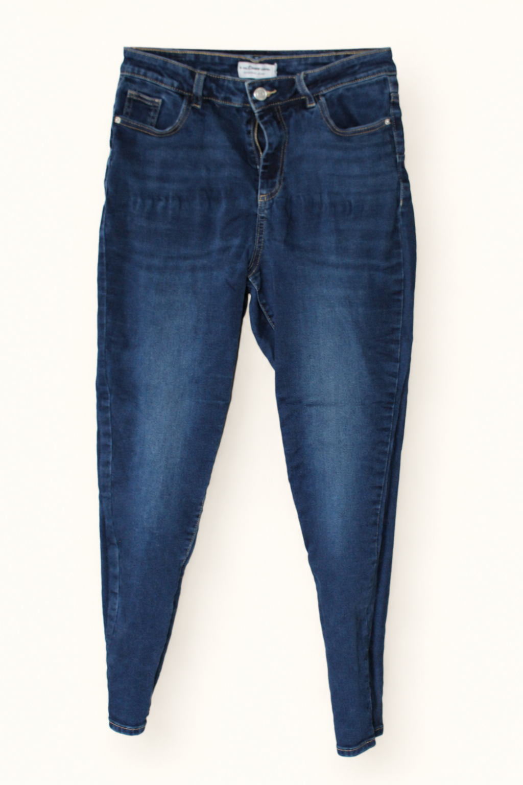 CR-0033, Blue-Wash Slim-Leg Jeans, garment-only front view. AI-edited from the actual garment photo.