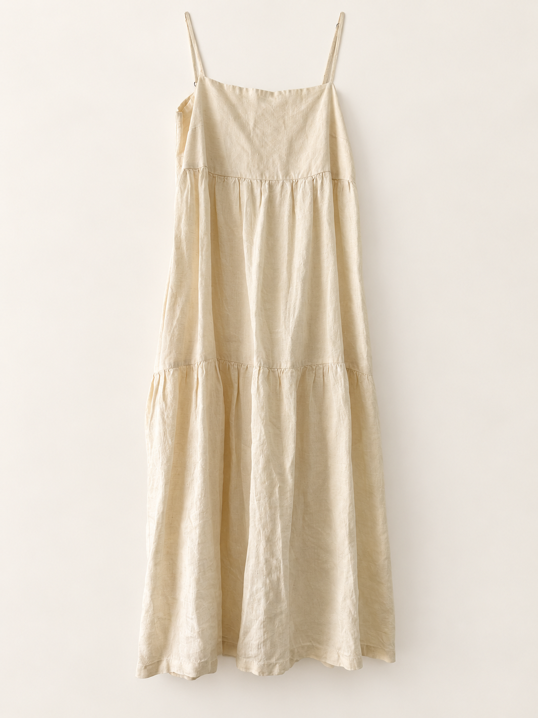 AI-edited garment-only front view of Assembly Label Cream Strappy Tiered Dress, based on the actual item photo