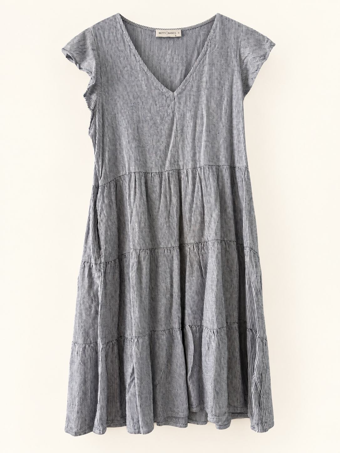 AI-edited garment-only front view of Betty Basics Fine-Stripe Tiered Dress, based on the actual item photo